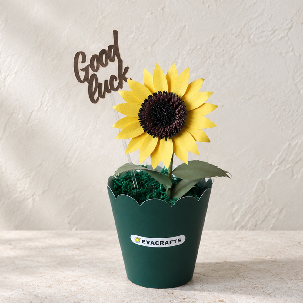 Finished 3D paper sunflower in a flower pot made from cardstock using a sunflower SVG template, decorated with a Good Luck topper