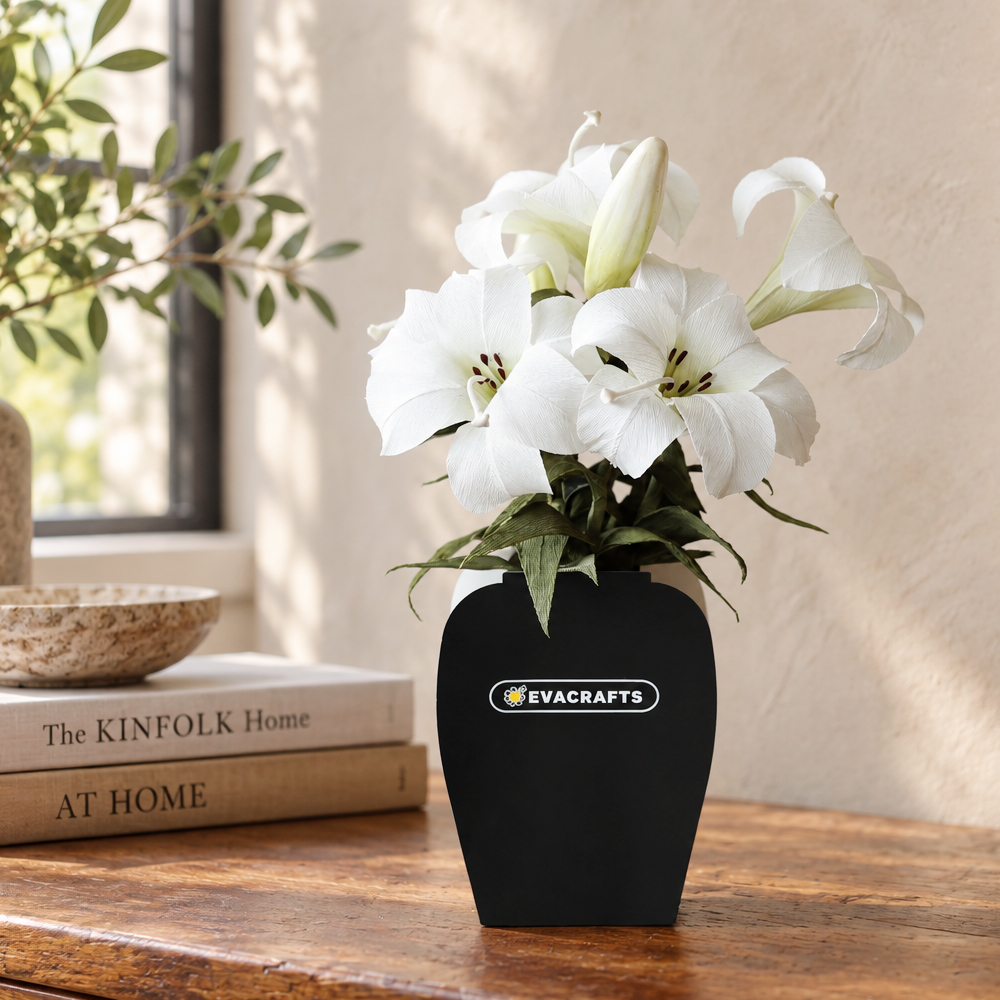 White crepe paper lily flowers arranged in a black vase for elegant home decor