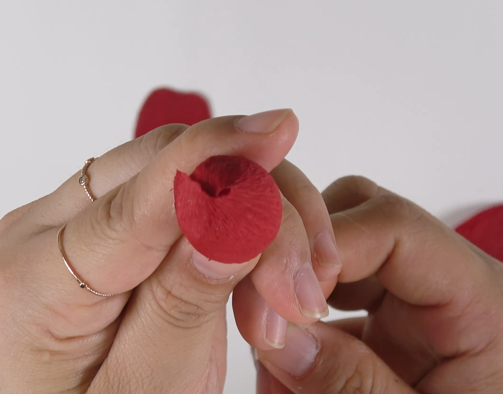Wrapping the entire rosebud foam with crepe paper for a realistic crepe paper rose