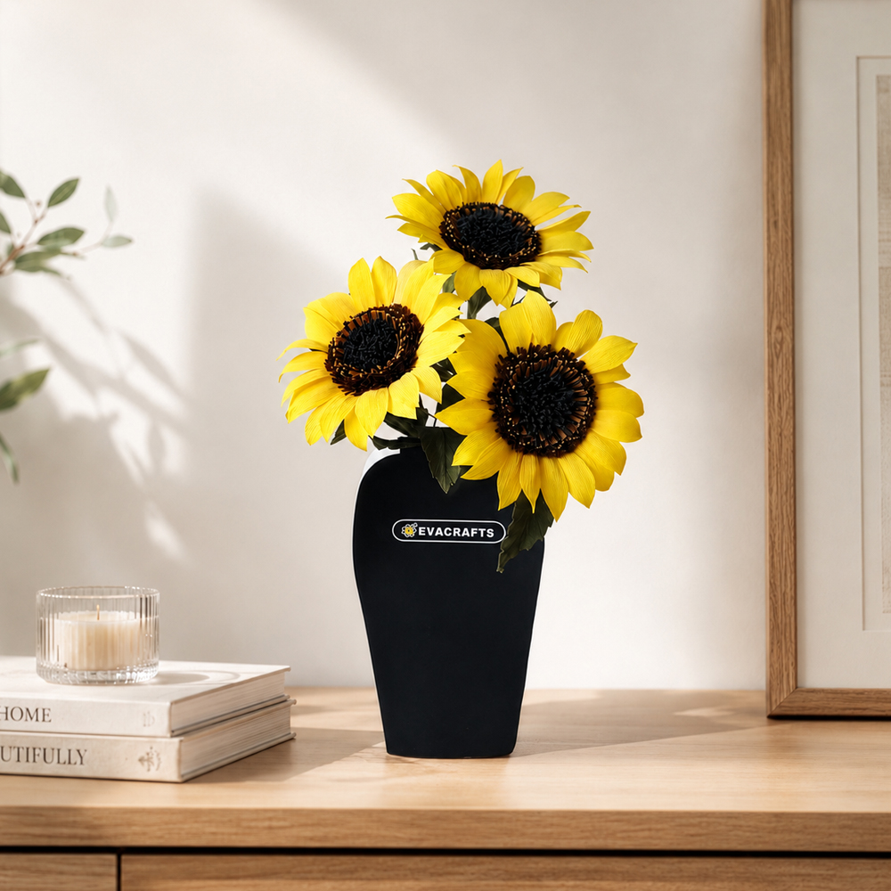 Realistic crepe paper sunflowers arranged in a black vase as bright home decor