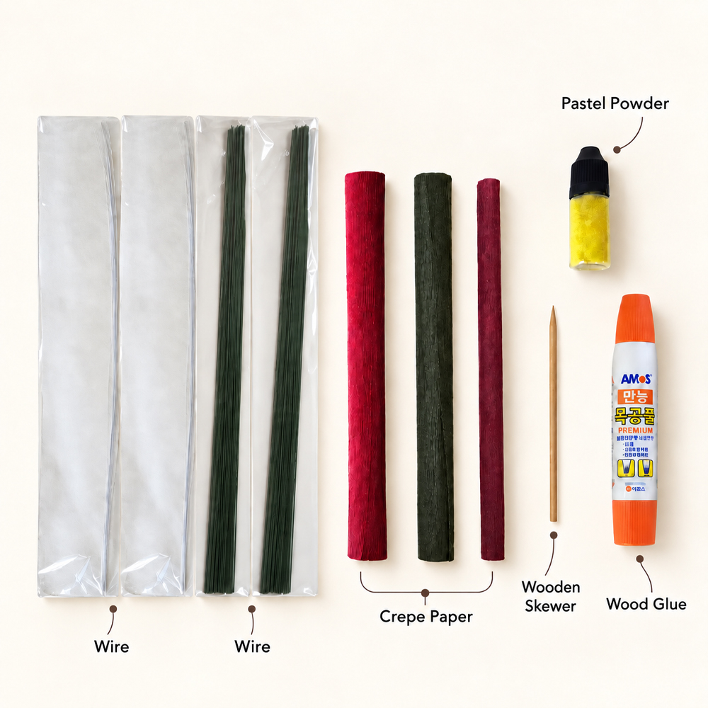 Materials for making a tropical hibiscus flower from crepe paper, including wire, red and green crepe paper, pastel powder, a wooden skewer, and wood glue