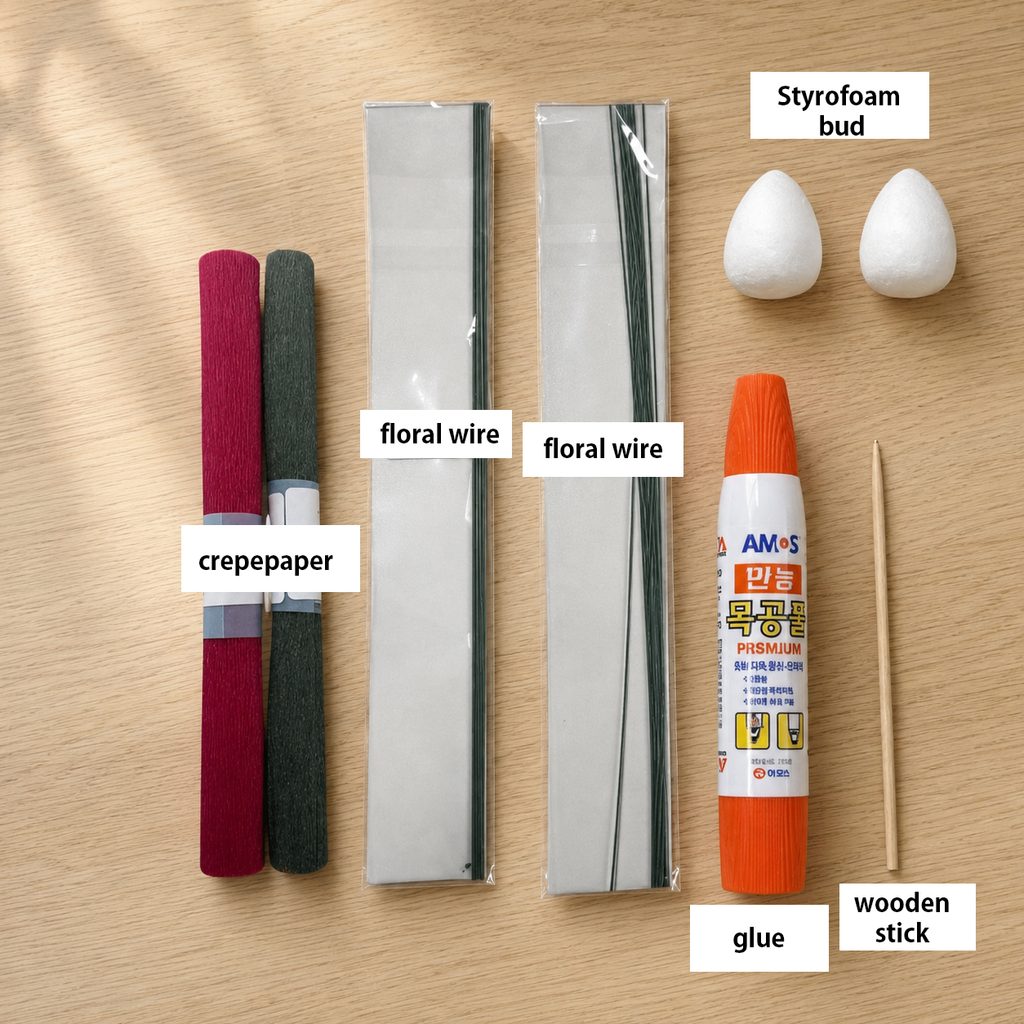 Crepe paper rose materials including Italian crepe paper, floral wire, Styrofoam buds, wood glue, and a wooden stick