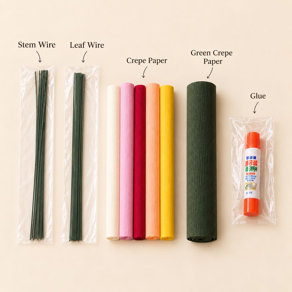 Materials for making crepe paper zinnia flowers, including stem wire, leaf wire, colorful crepe paper, green crepe paper, and glue.