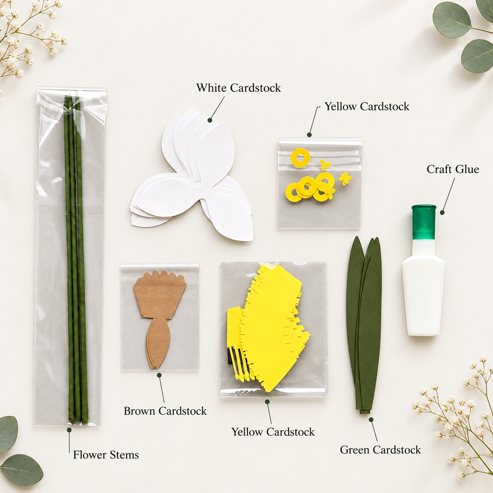 Materials for making a paper daffodil with white, yellow, green, and brown cardstock, floral stems, and craft glue