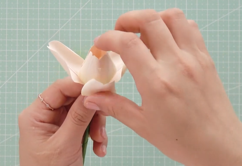 Adding the second layer of paper tulip petals between the first petals